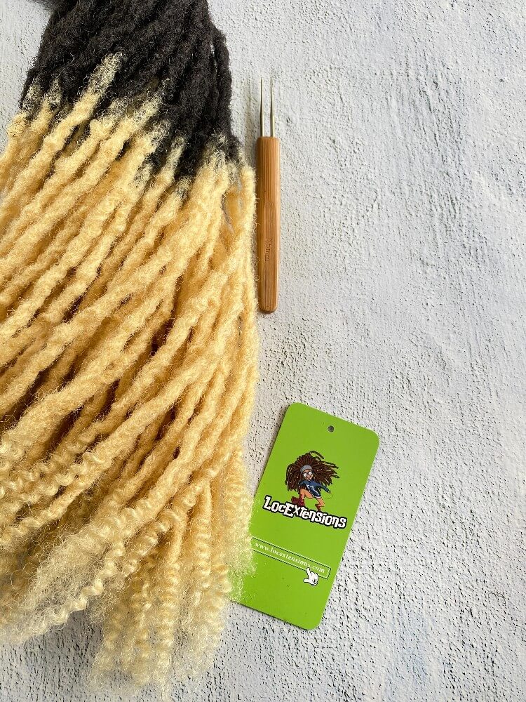 Curly Anwi textured human hair loc extensions with T1B/613 blonde tips